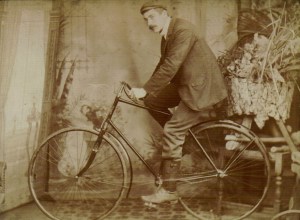 Alfred Henry Buckingham, possibly seated on a Hibbs-Buckingham bicycle (?) c 1900.